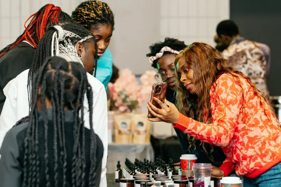 Two entrepreneurs at their stall during a Bridge Alliance Canada vendor market